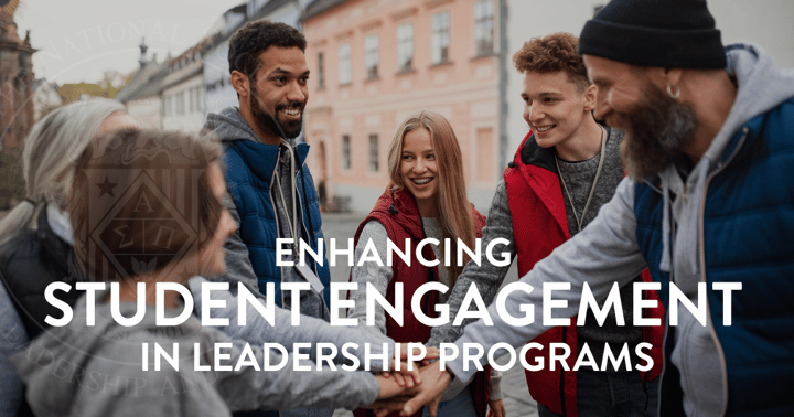 A group of young student leaders in a huddle getting ready to take on a task.